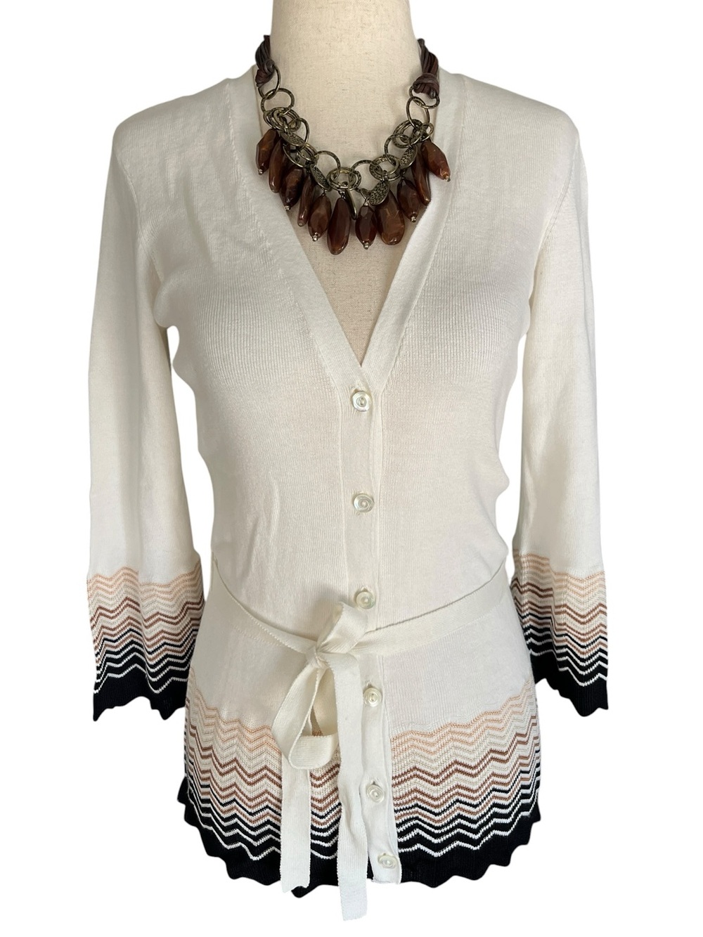 Trina Turk cardigan features a signature chevron pattern along the hem and cuffs
